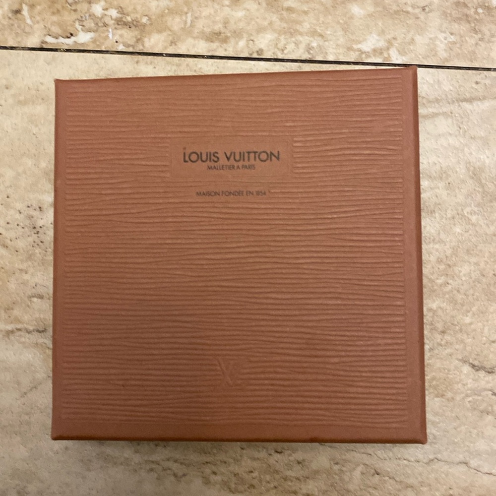 Louis Vuitton box in excellent used condition 5 L x 5 H x 1.25 W approximately
